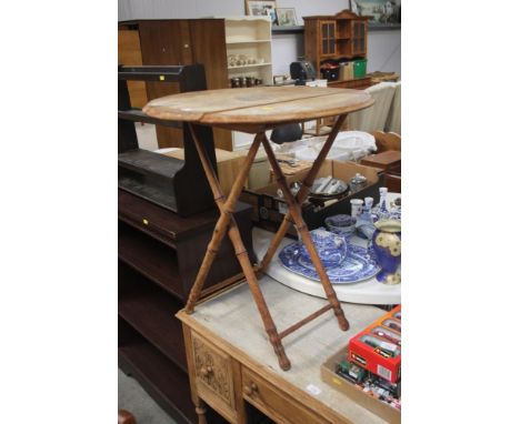 A folding bamboo table; together with a hanging shelf