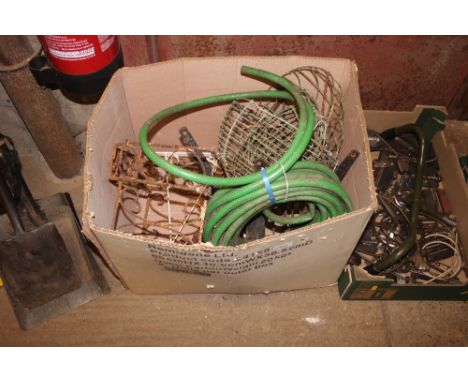A box containing hanging planters; a hose pipe etc