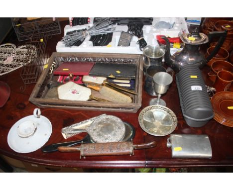 A silver plated teapot together with a hip flask, dressing table items, enamel chamberstick etc.