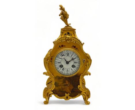 An early 20th century French Louis XV style yellow vernis martin mantel clock
Applied with gilt metal mounts, the enamelled d