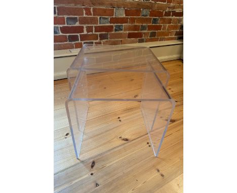 A nest of two vintage acrylic nesting 'Ghost' tables
Of curved rectangular form, the largest 49cm wide, 42cm deep, 42cm high.