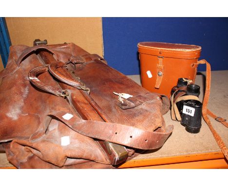 A leather holdall, a pair of vintage binoculars, a camera and a copper warming pan