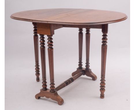 A Victorian mahogany oval Sutherland table, late 19th century; with fluted legs to sled bases with a conforming stretcher; 72