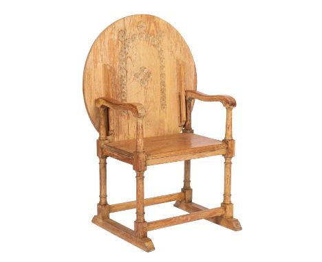 A light oak open monk's armchair in 17th-century style, 20th century; with a sliding circular carved rosette hinged top, soli