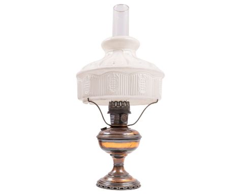 A copper and glass table oil lamp, 20th century, by the Aladdin Mantle Lamp Co.; with pressed milk glass shade and clear flue