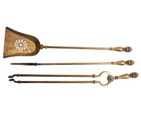 A set of Victorian brass fire tools, second half 19th century; comprising shovel, poker and tongs; all with baluster handles 
