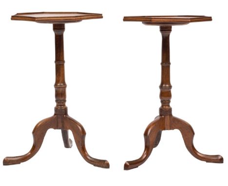 A matched pair of mahogany octagonal occasional tables, in the George III style; moulded tops, ring turned columns, and tripo