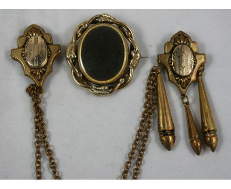 A Victorian gold plated swivel portrait brooch, with twist frame and a gilt metal cloak chain (2).