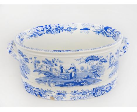 A 19th century Spode two-handled footbath, of oval form moulded with coopered bands and transfer printed in blue and white wi