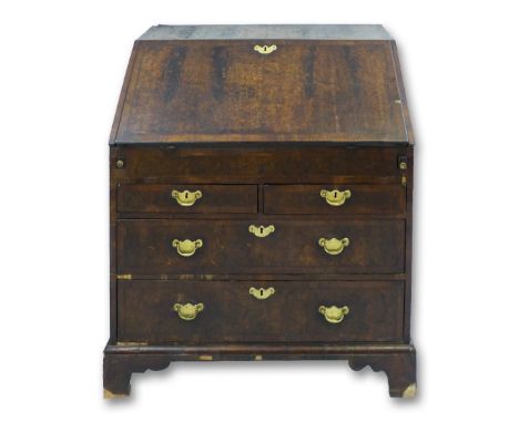 An 18th century walnut and feather banded mulberry bureau, the fall-front opening to reveal a fitted interior with inset writ