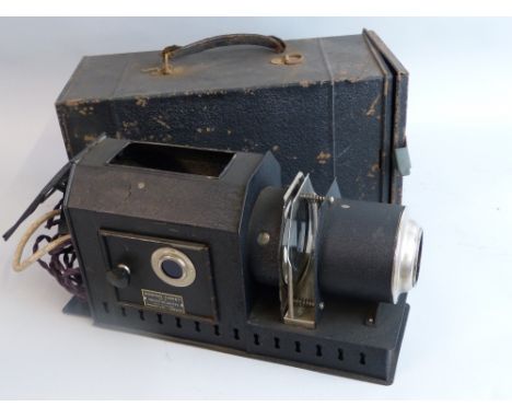 An Ensign Comet No.5 projection lantern, the tin body with black crackled finish and electrified illumination, in similarly f