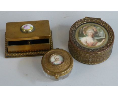 A dressing table box, late 19th/early 20th century, of circular form with cut clear glass base and ornate gilt brass hinged l