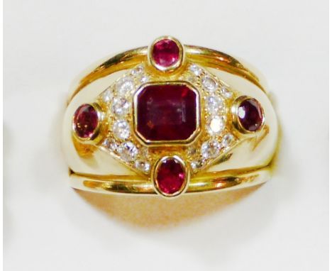 An 18ct gold ruby and diamond dress ring, by AR, London 2015, composed of a step cut collet set stone within a pave set brill