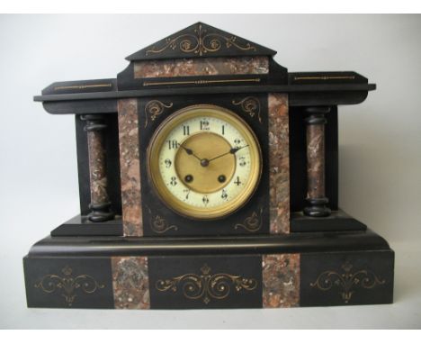 A Victorian black slate and variegated marble mantel clock, the cream dial with black Arabic numerals, the movement (unsigned