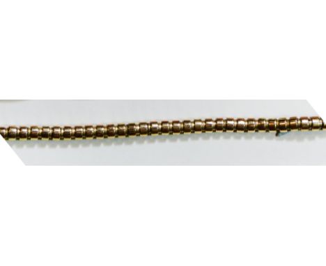 A gold Odenesque snake bracelet, unmarked, safety chain, weight 21 grams. 