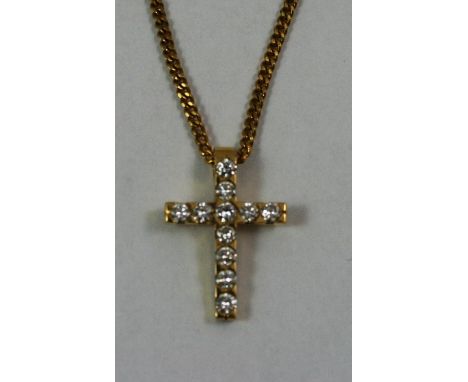 A Continental 18ct gold and diamond cross pendant, set with eleven brilliant cut stones, to a gilt metal chain, weight of pen