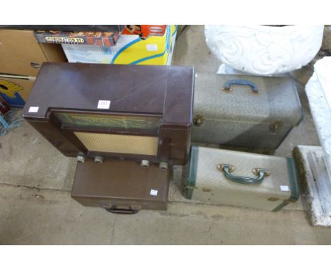 A vintage Remington typewriter, radio and two projectors