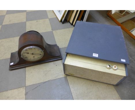 An oak chiming mantel clock and a Monarch record player