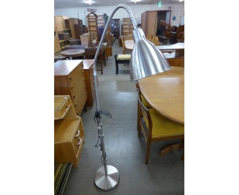 A chrome adjustable floor lamp