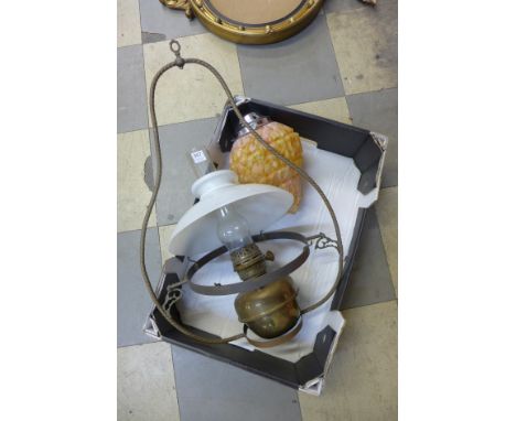 An Art Deco ceiling mottled glass light shade and a hanging oil lamp