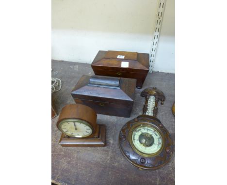 A walnut clock with French movement, a carved walnut barometer, both a/f, and two sarcophagus shaped tea caddies, one a/f