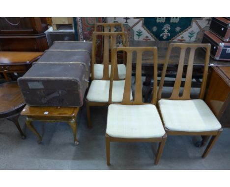 A set of four teak chairs, banded cabin trunk and a burr walnut coffee table