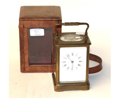 A brass striking carriage clock, early 20th century, twin barrel movement with a later platform lever escapement, with fitted