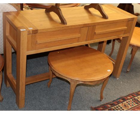 ^ A modern light oak side table fitted with two drawers 