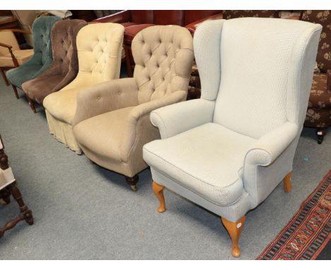 ^ A group of upholstered chairs comprising a wing back, four button backs, and two open arm tub chairs (7)