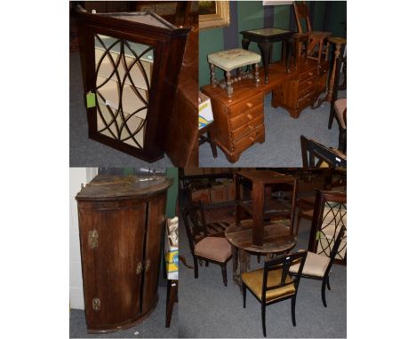 An assortment of 19th and 20th century furniture comprising: two mahogany hanging corner cupboards, a drop leaf table, five a