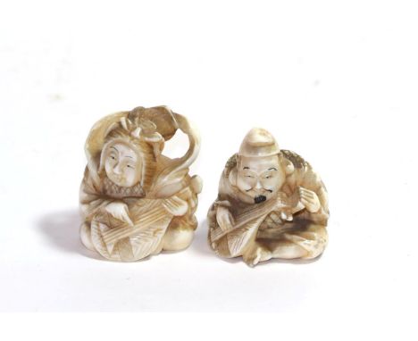 A Japanese ivory netsuke, Meiji period, as Daikokuten sitting, playing a biwa, signed, 3.5cm high; and a similar figure of Be