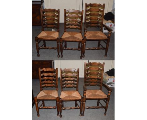 A set of six (4 + 2) rush seated ladder back chairs probably Titchmarsh &amp; Goodwin