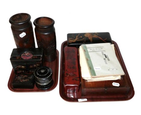 A group of Chinese items including: lacquered glove boxes; carved bamboo sleeve vases; booklets of calligraphy; a Chinese tex