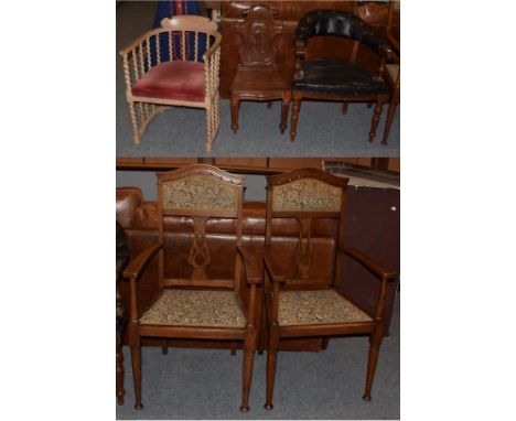 A pair of early 20th century carved oak hall chairs in the Arts &amp; Crafts taste, a leather upholstered button back club ch