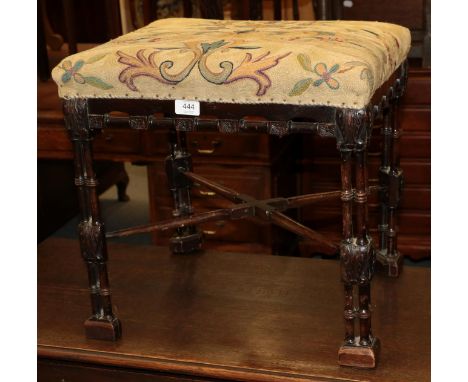 A 19th century Chippendale style mahogany stool, the pierced and turned frieze raised on turned triple column legs joined by 