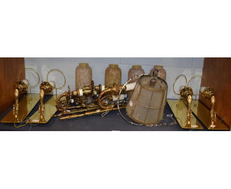 ^ A set of four gilt metal scroll cast single wall lights with brass back plates and marble glass shades; together with three