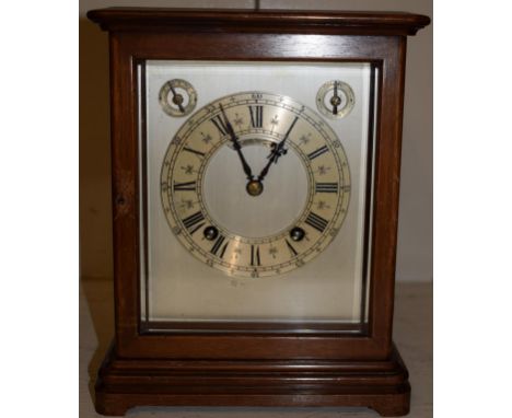 A German mahogany quarter striking mantel clock, movement stamped W&amp;H, retailed by Goldsmiths Co Ltd