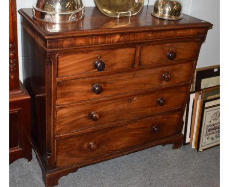 A George III mahogany chest of drawers, the moulded rectangular top over two short drawers above long graduated drawers and r