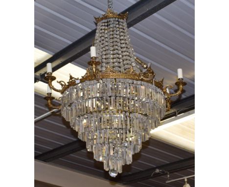 ^ An impressive gilt metal, lustre drop nineteen-light chandelier 