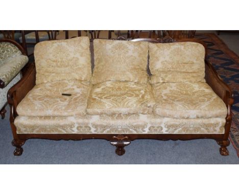 An early 20th century double caned three seater bergere sofa, 180cm wide 
