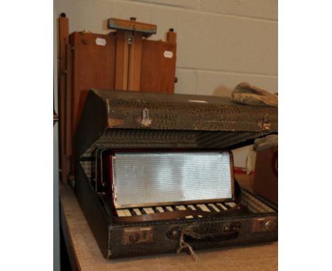 A cased Bell accordion and an Italian Mabef folding artists easel (2)