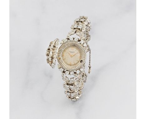 International Watch Co. Belle et rare montre de dame à capot en acier sertie de diamants mouvement mécaniqueInternational Wat