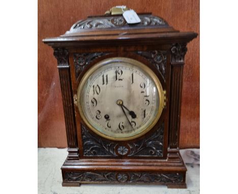 Late 19th/early 20th century ornately carved walnut two train bracket clock with key and pendulum appearing to be marked 'Bea