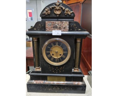 Late 19th/early 20th century black slate and coloured marble architectural two train mantle clock with yellow metal pillars a