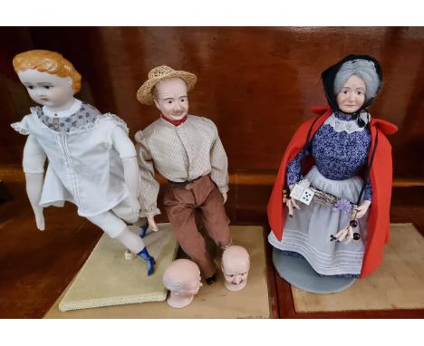Model study of a Welsh lady with tray around her neck, with needlework implements, in glass case. Together with another simil