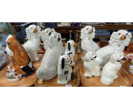 Three trays of 19th and 20th century Staffordshire dogs and a Basset Hound together with a small flatback 19th century Staffo