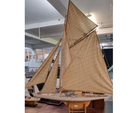 Large authentic model of a single mast yacht.  125cm high and 120cm long approx.  (B.P. 21% + VAT) 
