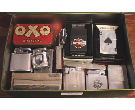 Collection of Zippo lighters, to include: Harley Davidson, Ace of Spades, Antique German Drjm Nurmi tinder box, brass lighter