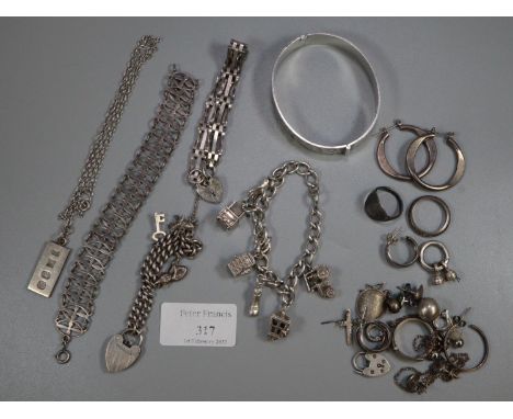 Collection of silver and white metal jewellery: charms, bangle, dress rings etc.  (B.P. 21% + VAT) 