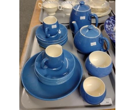 Tray of Moorcroft art pottery blue glazed china to include: saucers, milk jug, sugar bowls, plate, teapot and coffee pot etc.